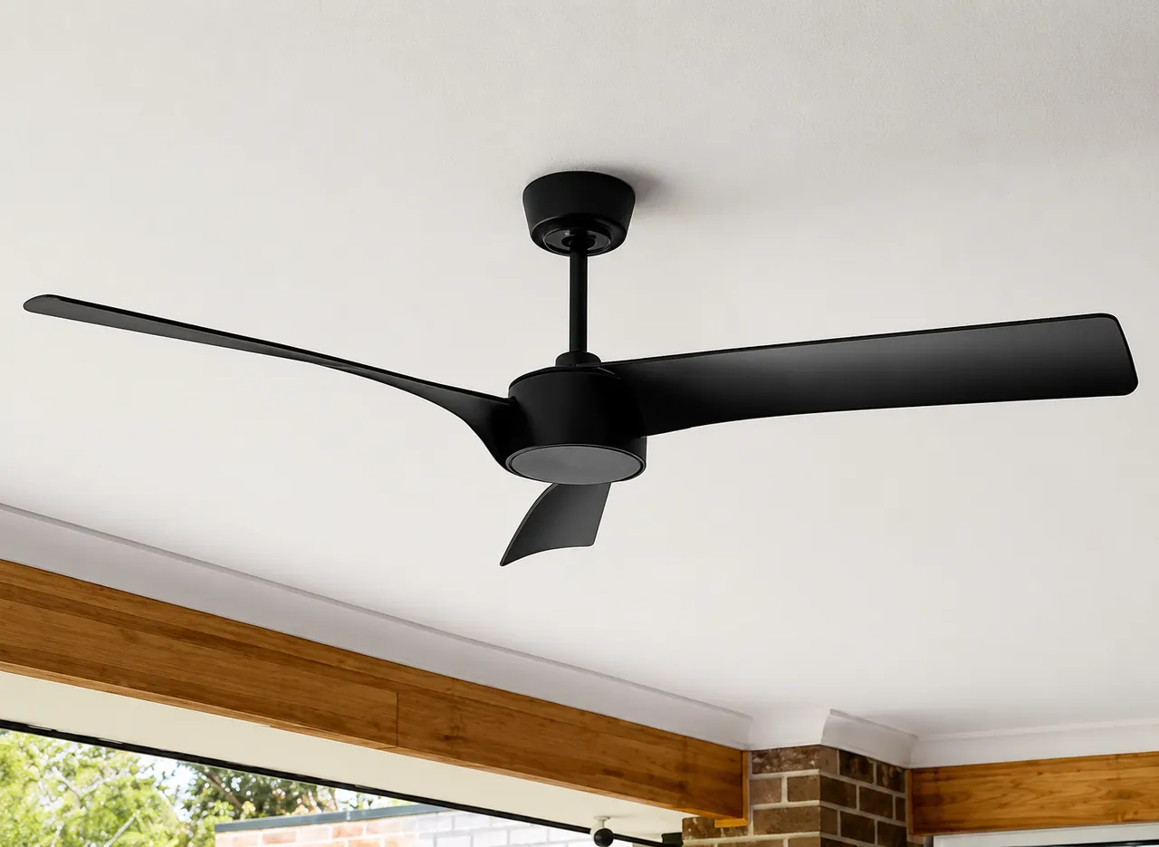 Black three-blade ceiling fan installed on a raked timber-lined ceiling